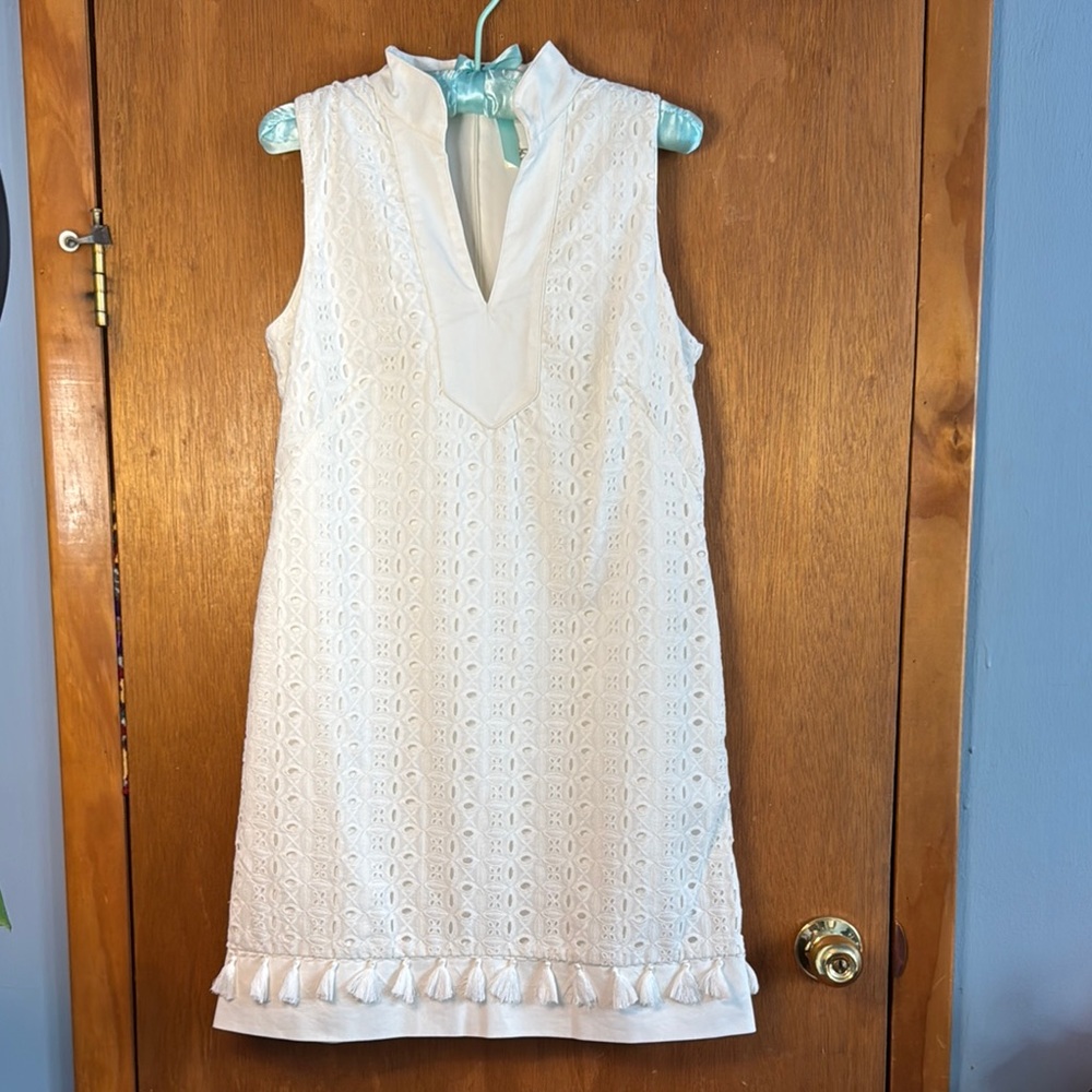 Eliza J Ivory Sleeveless eyelet dress with fringe detail on bottom hem. Sz 4